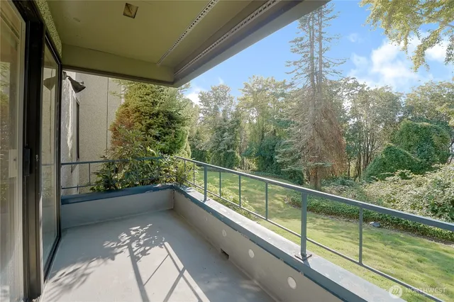 a view of balcony with a swimming pool