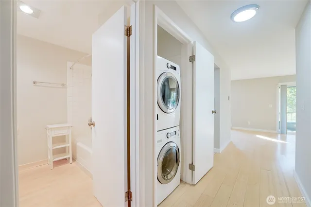 a view of a hallway with washer and dryer