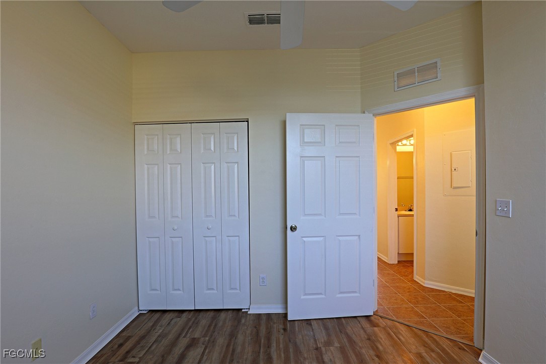 4199 Bellasol Circle, Unit 622 Fort Myers, FL 33916 - Photo 12 of 27 a view of front door with wooden floor