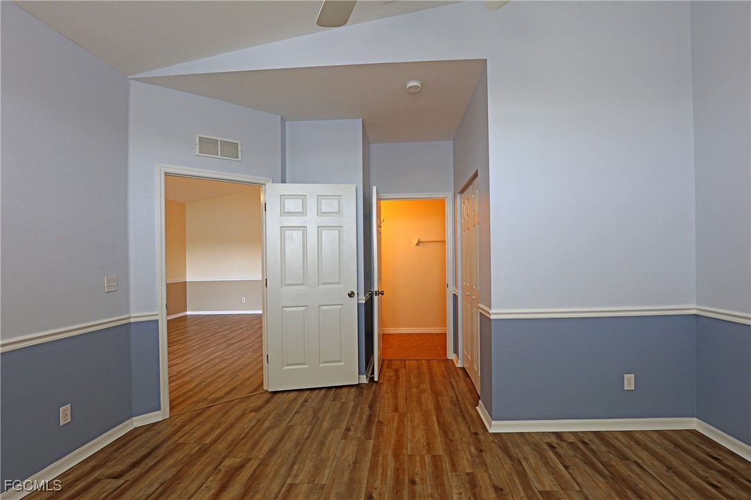 4199 Bellasol Circle, Unit 622 Fort Myers, FL 33916 - Photo 17 of 27 wooden floor in an empty room