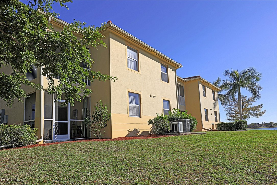 4199 Bellasol Circle, Unit 622 Fort Myers, FL 33916 - Photo 24 of 27 a view of a house with backyard and garden