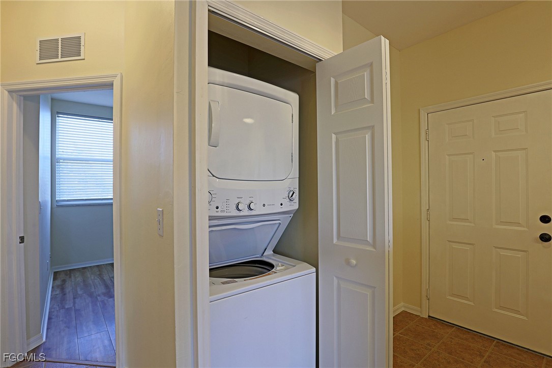 4199 Bellasol Circle, Unit 622 Fort Myers, FL 33916 - Photo 10 of 27 a room that has a bed and a table in it