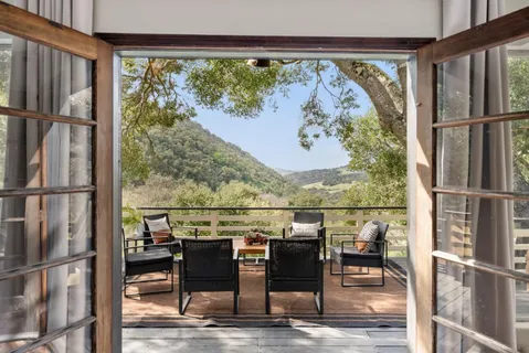 a view of a chairs and table in a room