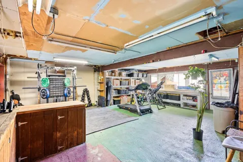 a room with lots of table and chairs