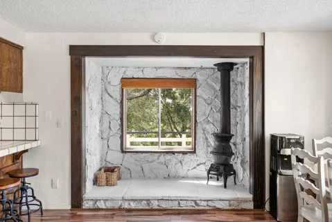 a living room with furniture and a floor to ceiling window