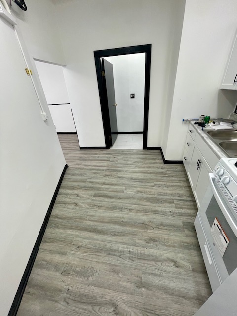 302 West Naperville Road Westmont, IL 60559 - Photo 13 of 15 a view of a kitchen from a hallway