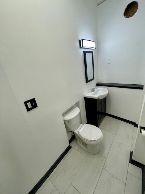 302 West Naperville Road Westmont, IL 60559 - Photo 15 of 15 a white toilet sitting next to a bathroom sink