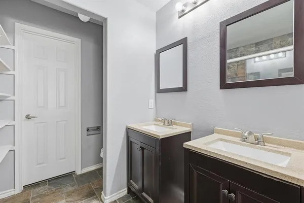 a bathroom with a sink and a mirror