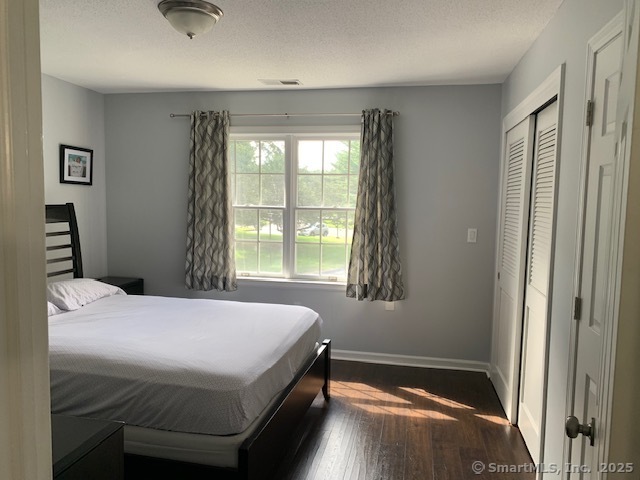 81 The Meadows, Unit 81 Enfield, CT 06082 - Photo 13 of 18 a bedroom with a bed and a window