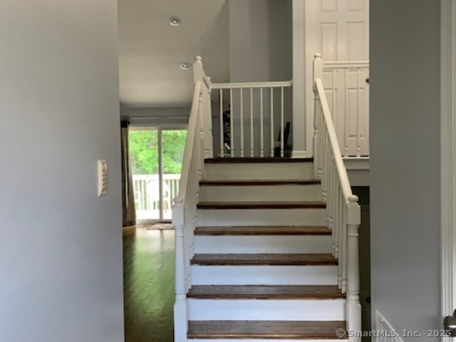 81 The Meadows, Unit 81 Enfield, CT 06082 - Photo 2 of 18 a view of entryway with wooden floor and front door