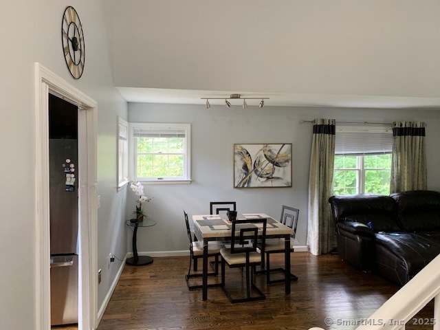 81 The Meadows, Unit 81 Enfield, CT 06082 - Photo 3 of 18 a view of a dining room with furniture and window