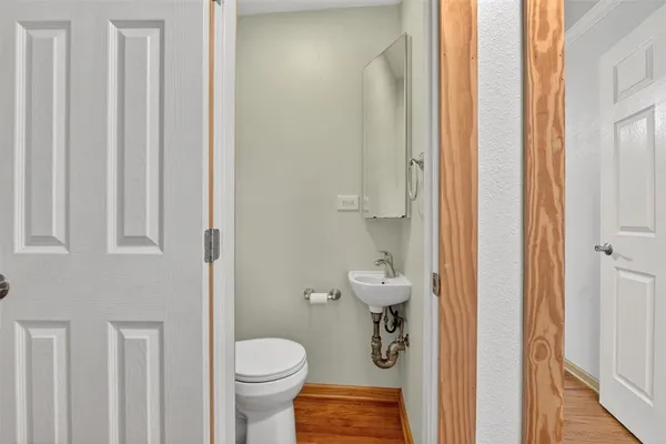 a bathroom with a toilet and a shower curtain