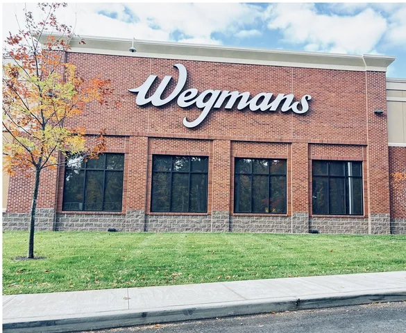 a front view of a building with garden