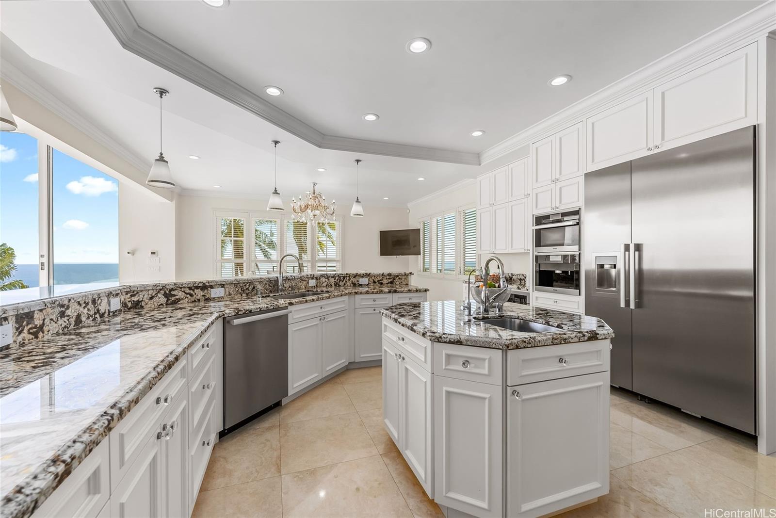 269 Kaialii Place Honolulu, HI 96821 - Photo 12 of 25 a kitchen with stainless steel appliances granite countertop a sink stove and refrigerator