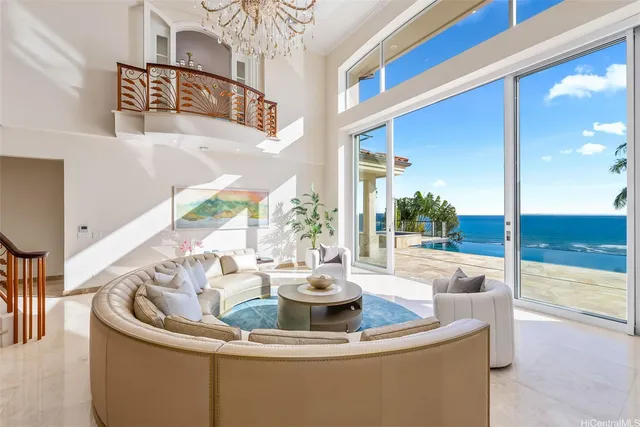 a kitchen with a stove a sink and a dining table with garden view