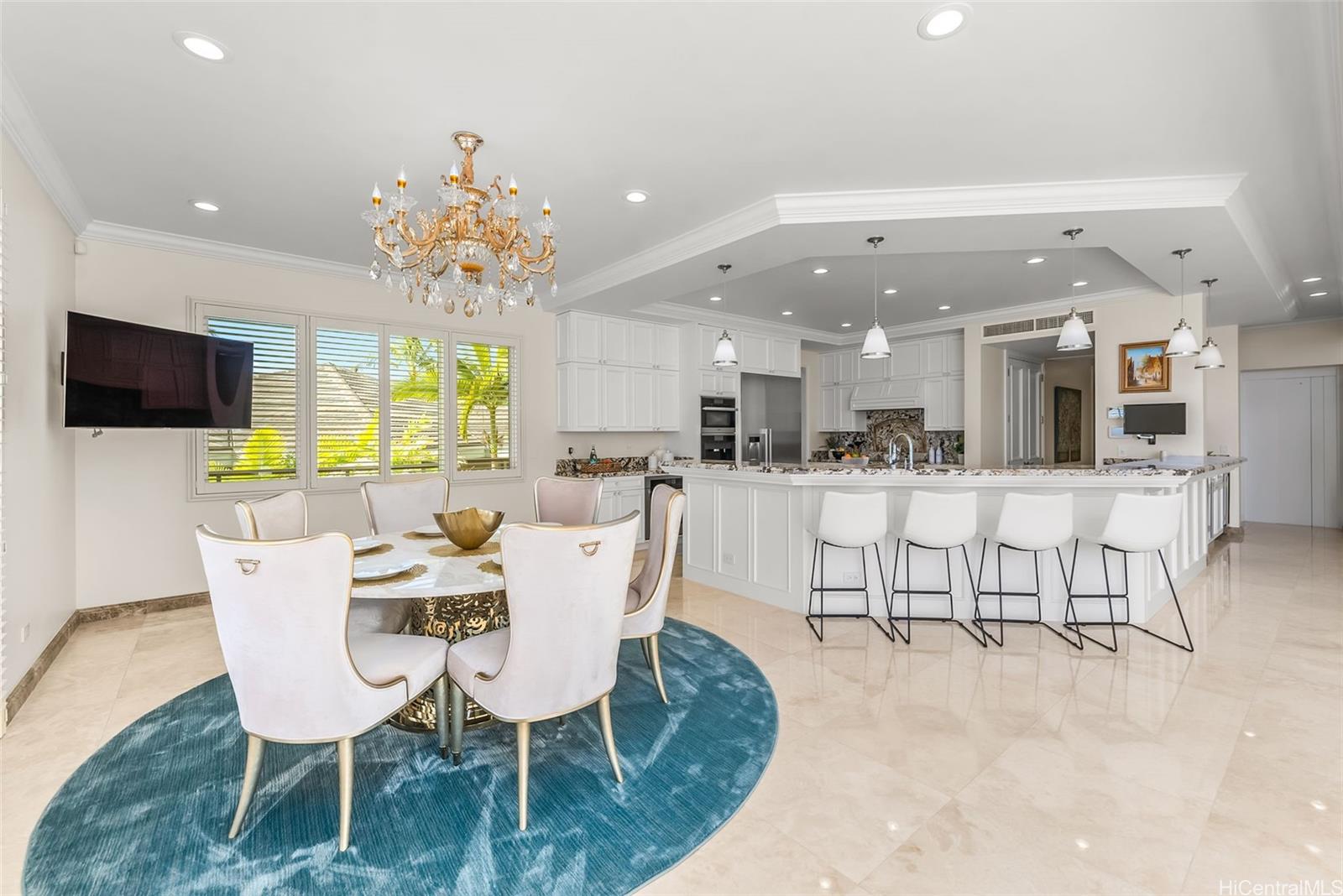 269 Kaialii Place Honolulu, HI 96821 - Photo 10 of 25 a dining room with furniture a chandelier and kitchen view