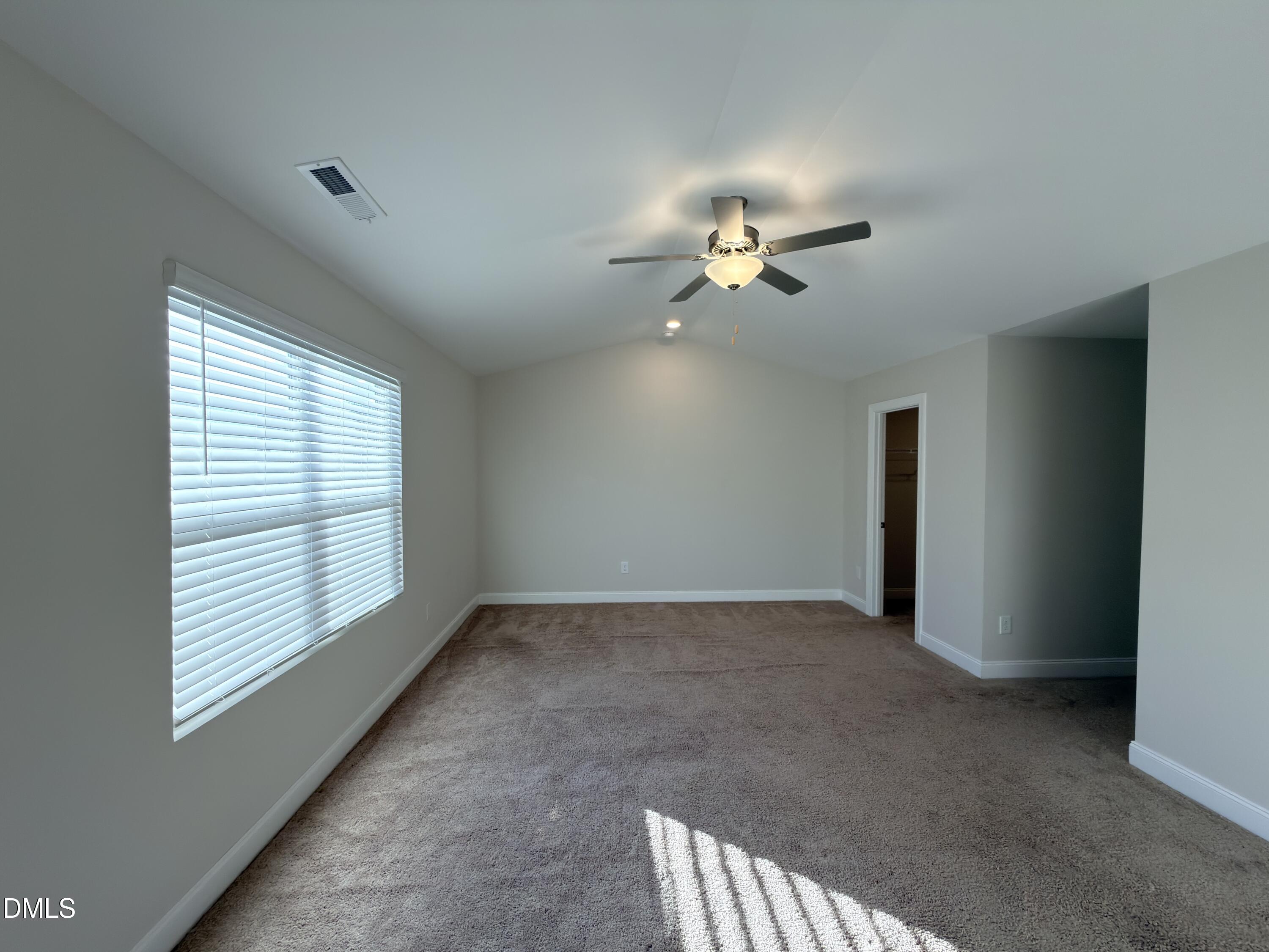 6928 Outfall Point Lane Raleigh, NC 27616 - Photo 15 of 33 a view of an empty room with a window
