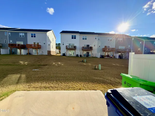 a view of a living room and kitchen