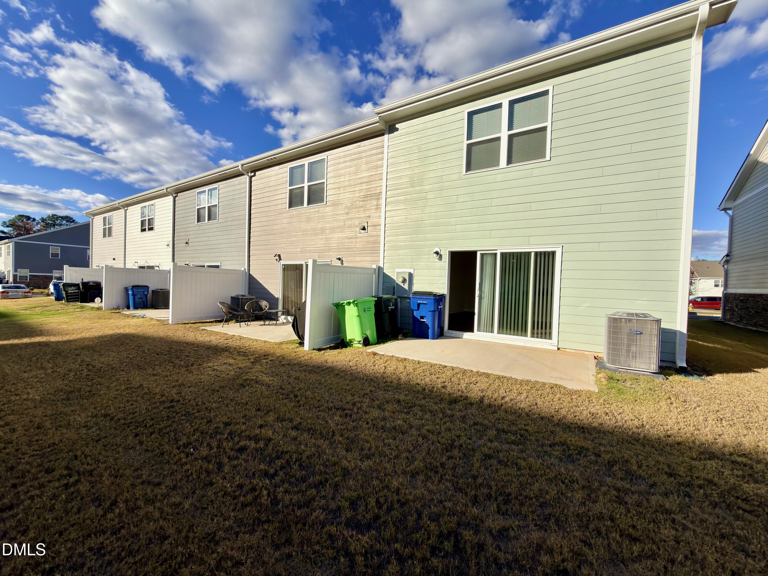 6928 Outfall Point Lane Raleigh, NC 27616 - Photo 27 of 33 a view of a house with backyard and sitting area