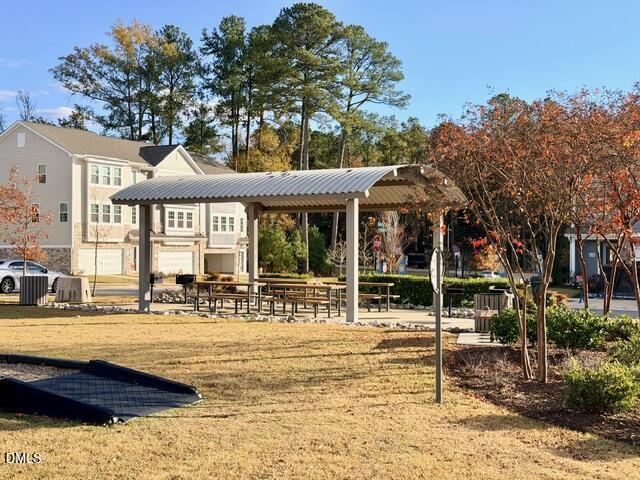 6928 Outfall Point Lane Raleigh, NC 27616 - Photo 28 of 33 a front view of a house with swimming pool and porch with furniture