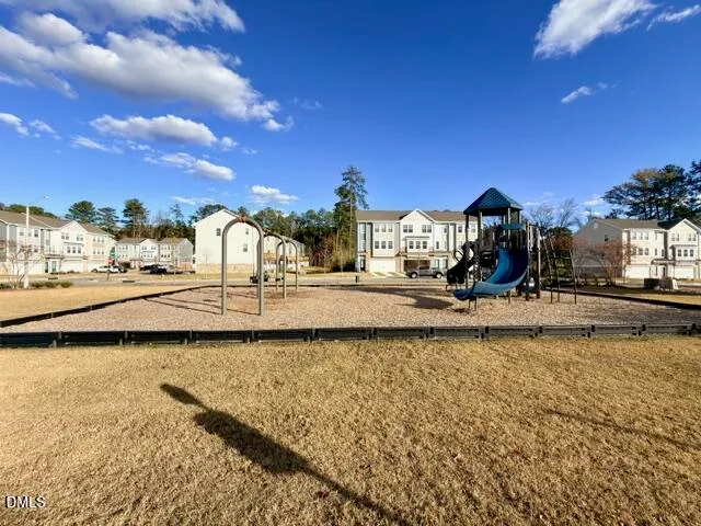 a view of a swimming pool with a yard