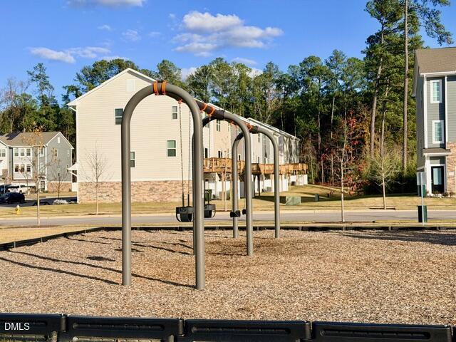 6928 Outfall Point Lane Raleigh, NC 27616 - Photo 30 of 33 a view of a swimming pool with a yard