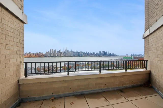 a view of a balcony with city view