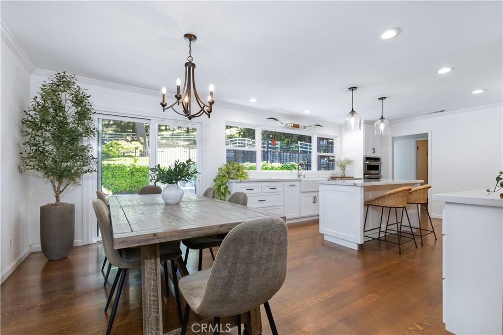 7695 Del Rio Road Atascadero, CA 93422 - Photo 21 of 75 a view of a dining room with furniture window and wooden floor