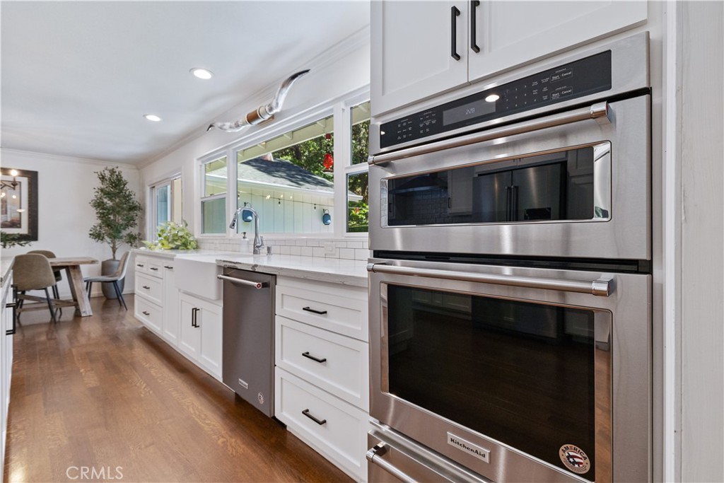 7695 Del Rio Road Atascadero, CA 93422 - Photo 25 of 75 a kitchen with stainless steel appliances a stove microwave and cabinets
