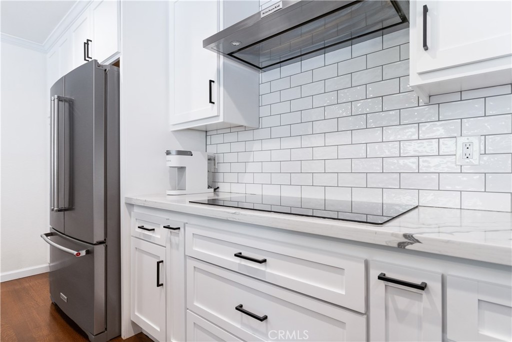 7695 Del Rio Road Atascadero, CA 93422 - Photo 29 of 75 a kitchen with a refrigerator and cabinets