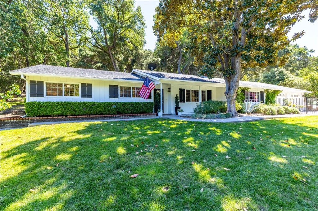 7695 Del Rio Road Atascadero, CA 93422 - Photo 3 of 75 a front view of a house with garden