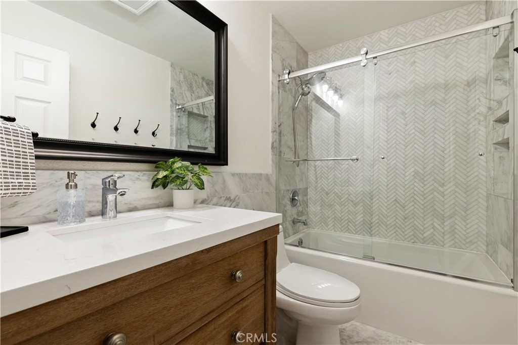 7695 Del Rio Road Atascadero, CA 93422 - Photo 37 of 75 a bathroom with a sink a toilet and shower
