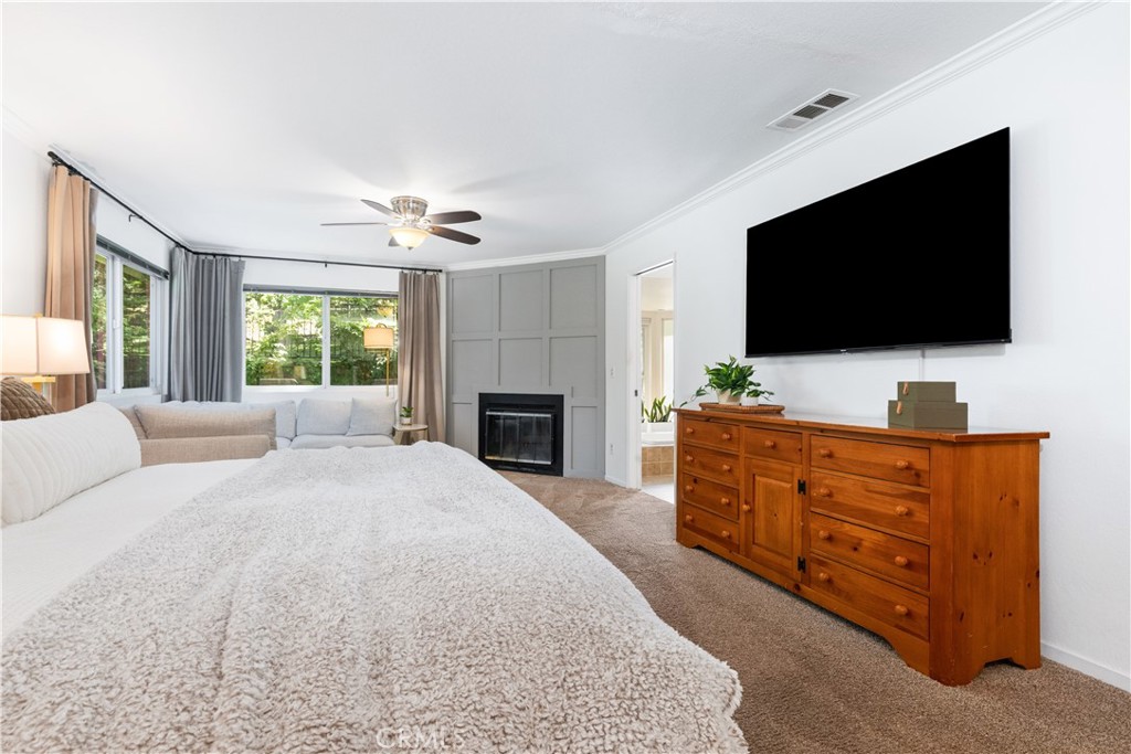 7695 Del Rio Road Atascadero, CA 93422 - Photo 43 of 75 a spacious bedroom with a large bed and a flat screen tv