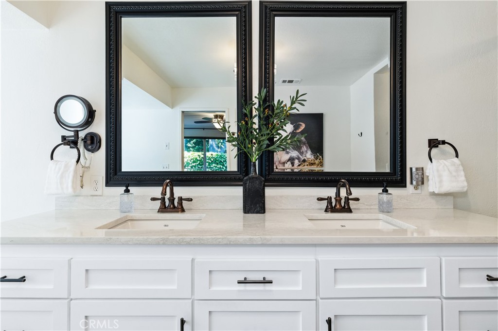 7695 Del Rio Road Atascadero, CA 93422 - Photo 47 of 75 a bathroom with double vanity sinks and a mirror