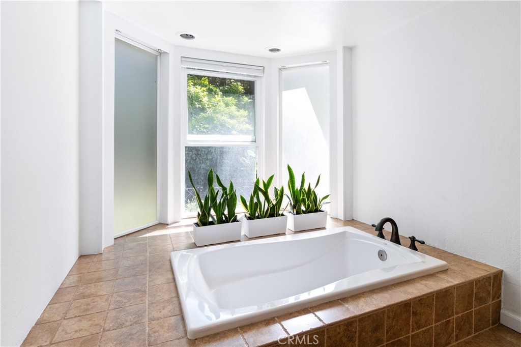 7695 Del Rio Road Atascadero, CA 93422 - Photo 49 of 75 a white bath tub sitting in a bathroom