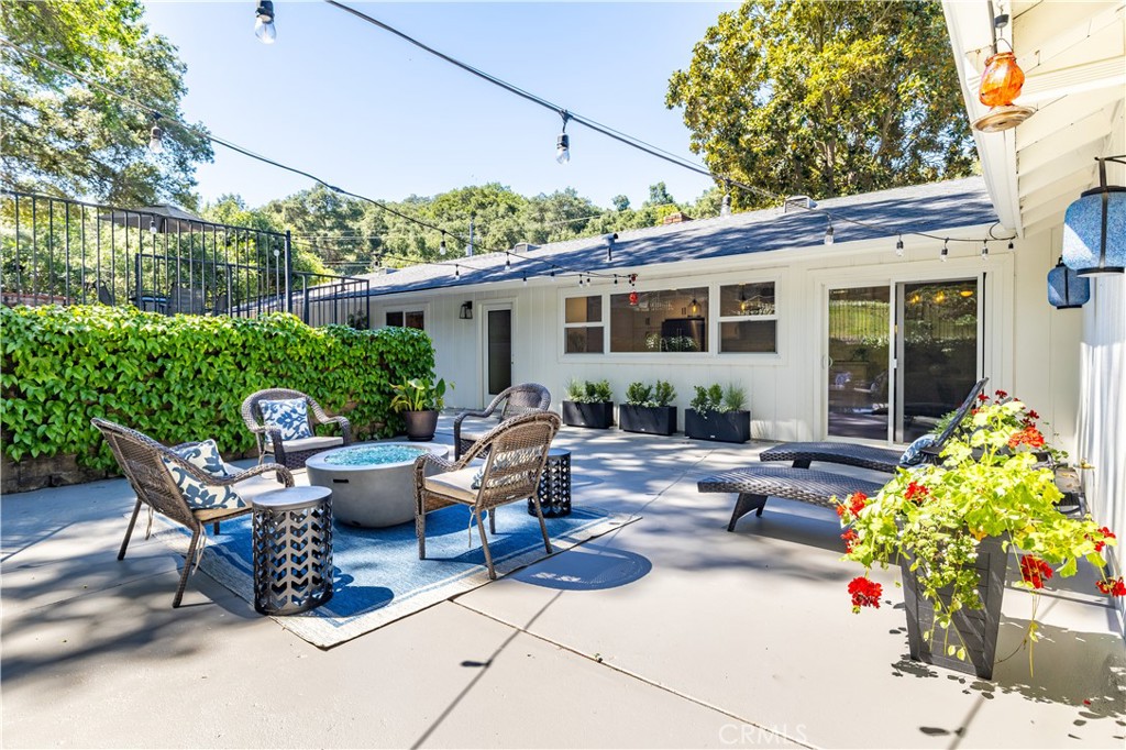 7695 Del Rio Road Atascadero, CA 93422 - Photo 53 of 75 a view of a patio with couches table and chairs and potted plants