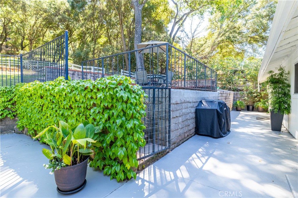 7695 Del Rio Road Atascadero, CA 93422 - Photo 56 of 75 a view of a garden filled with lots of potted plants