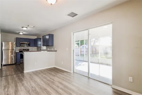 a view of kitchen with wooden floor