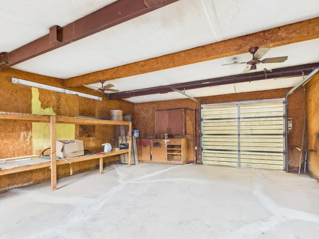a view of a room with wooden furniture
