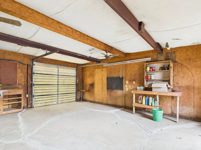 a view of a room with furniture and a window