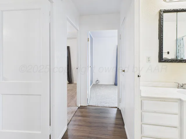 a view of a bathroom with a bathtub and a shower