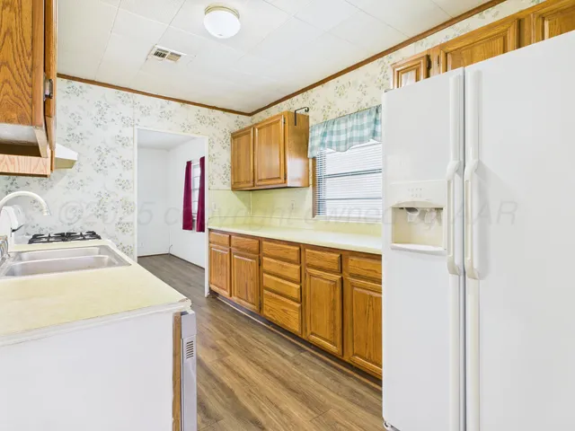 a kitchen with a refrigerator a sink and dishwasher