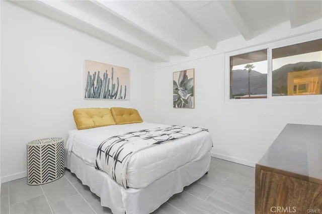 a bathroom with a sink a toilet and shower curtain