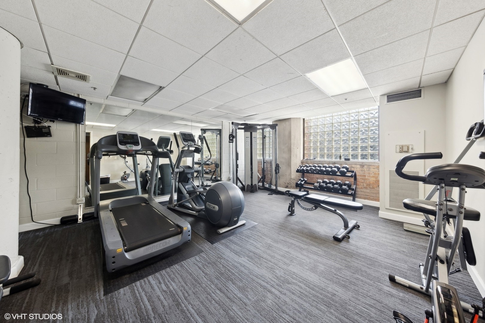 320 East 21st Street, Unit 215 Chicago, IL 60616 - Photo 24 of 25 a view of a room with gym equipment