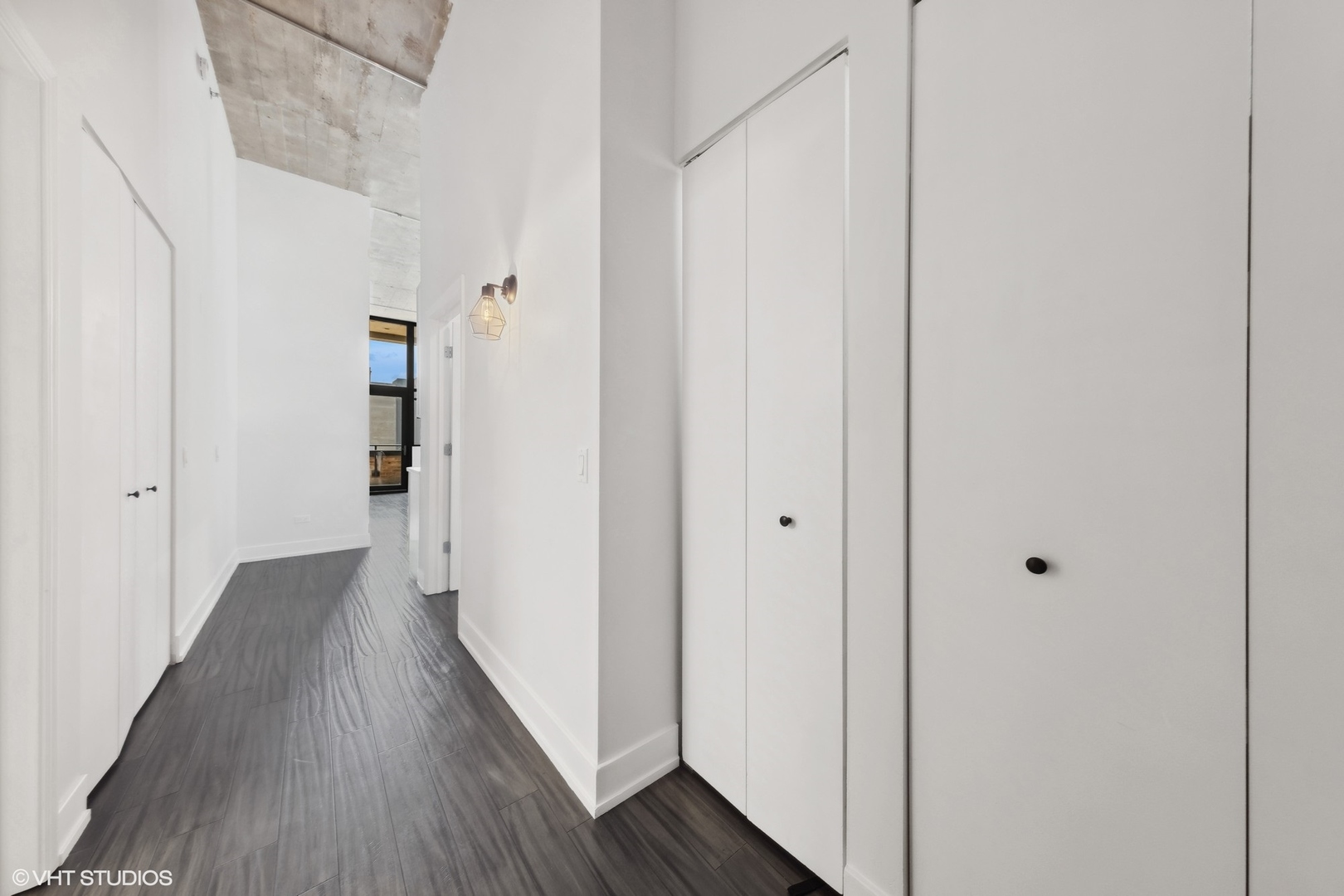 320 East 21st Street, Unit 215 Chicago, IL 60616 - Photo 5 of 25 a view of a hallway with wooden floor