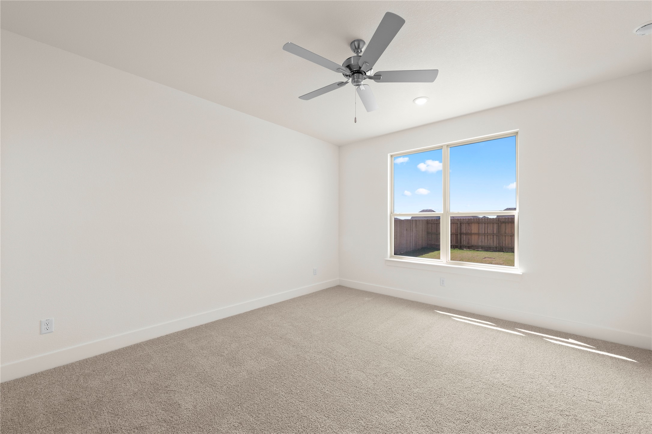 552 Gus Loop Georgetown, TX 78626 - Photo 14 of 23 an empty room with a window and a fan