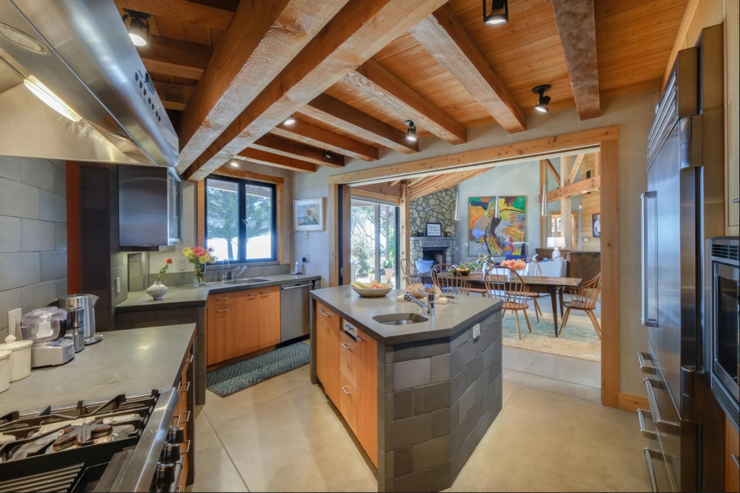 46820 Clear Ridge Road Big Sur, CA 93920 - Photo 19 of 26 a kitchen with a counter top space a sink stainless steel appliances and furniture