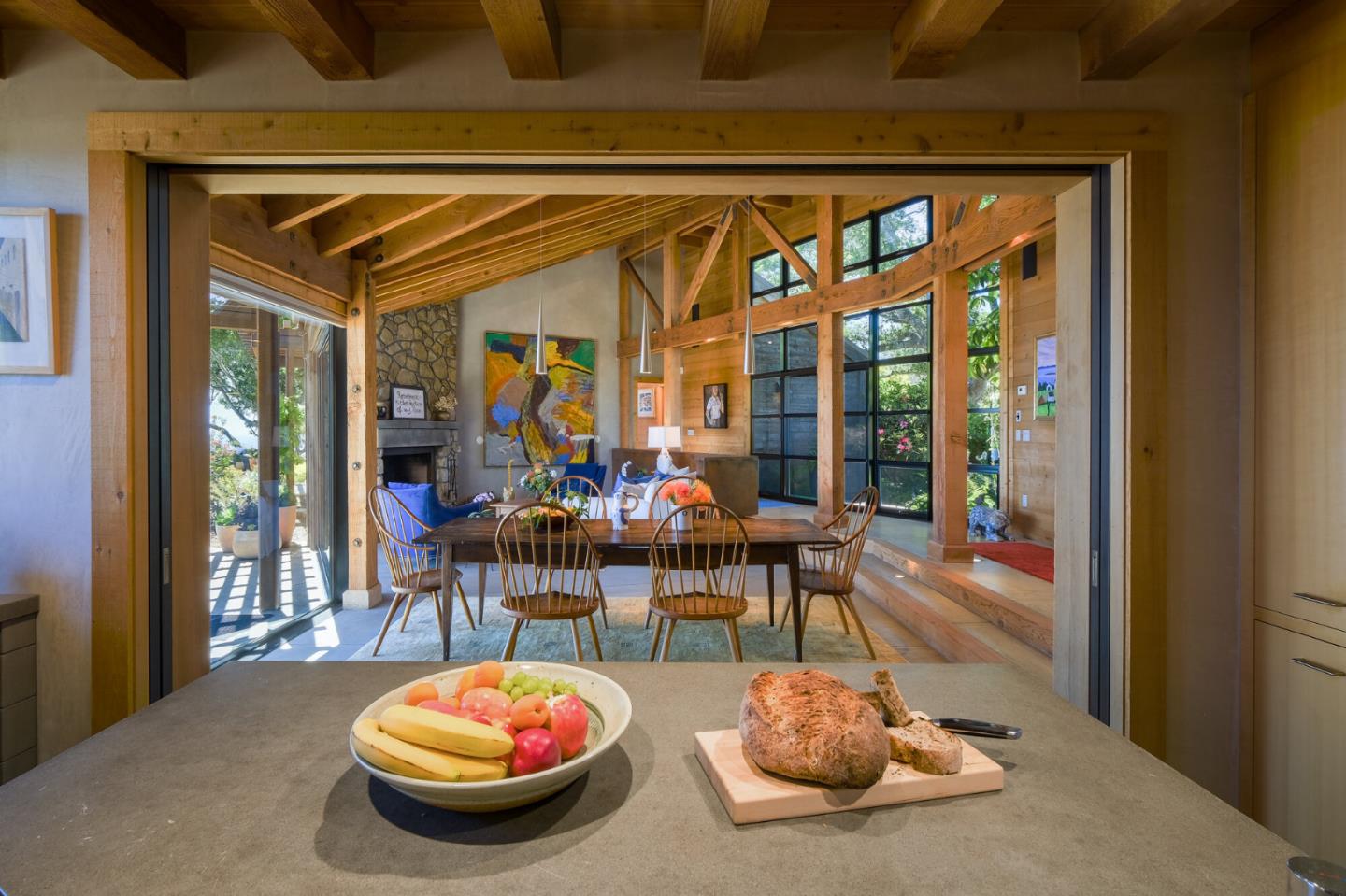 46820 Clear Ridge Road Big Sur, CA 93920 - Photo 6 of 26 a view of a dining room with furniture and a potted plant