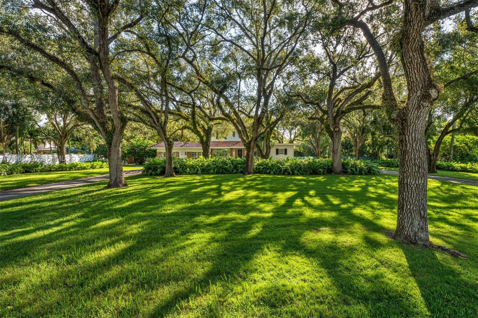 a view of grassy field with benches