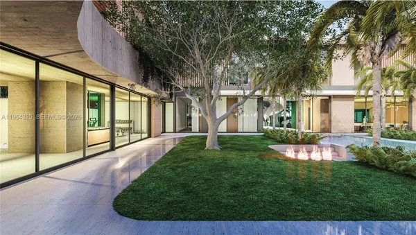 a view of a house with a big yard potted plants and large tree